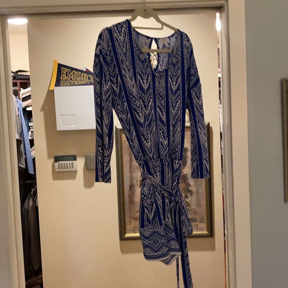 Flowy shorts romper with tie belt.